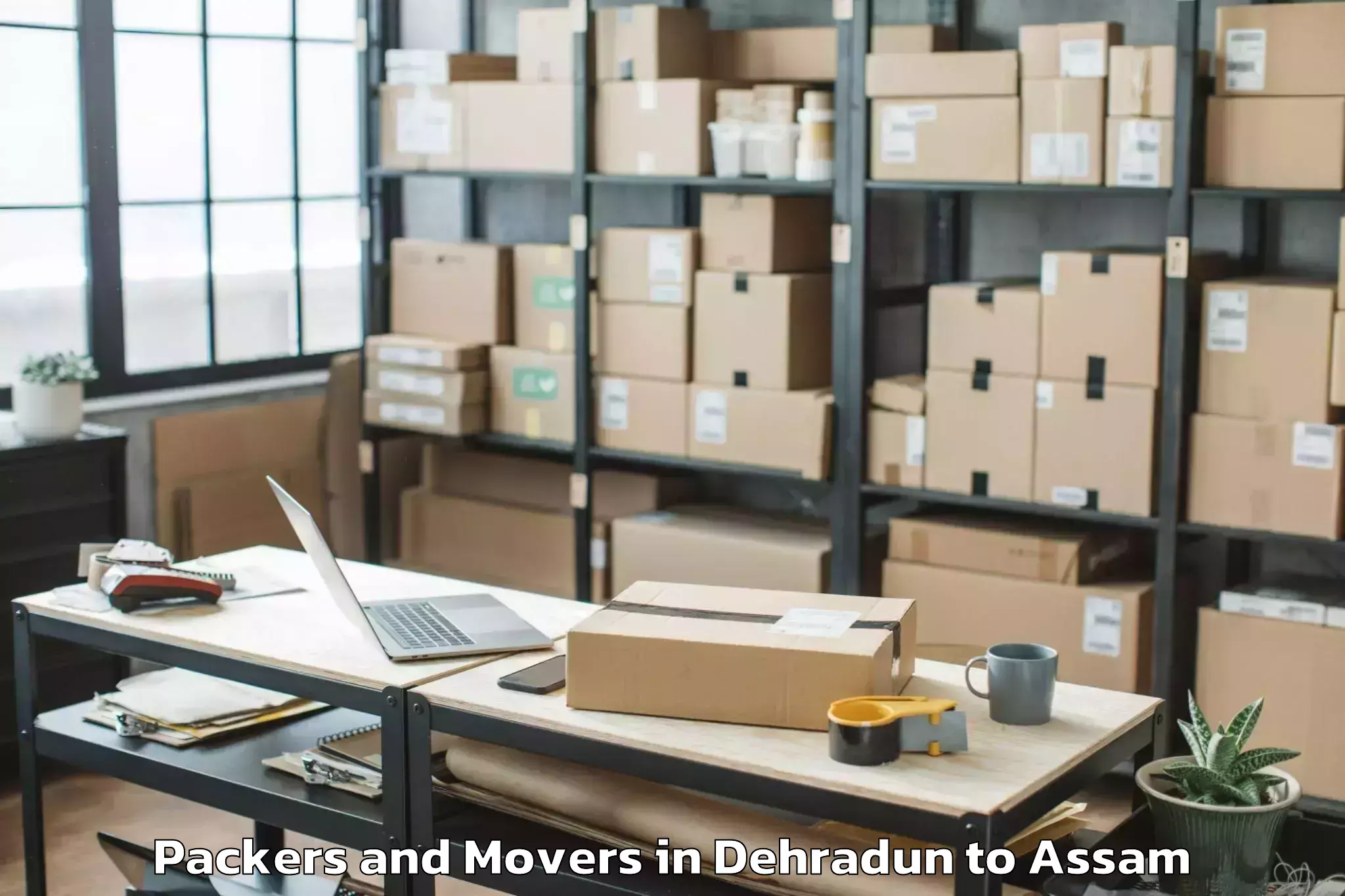 Get Dehradun to Sualkuchi Packers And Movers